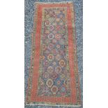 A Persian runner, late 19th/early 20th century, the blue ground rectangular field decorated with