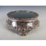A 19th century electroplated mirror topped table centrepiece/ cake stand, the original mirror