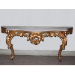 An 18th/19th century Continental gilt wood console table, the mottled grey and white marble top with