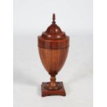 A late 19th century mahogany and chequer banded urn shaped knife box and cover, the domed cover with