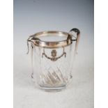 A white metal mounted glass ice bucket, the white metal collar with two foliate cast handles and