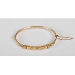 A 9ct gold, opal and diamond chip bangle, stamped marks, 7.1 grams.
