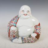 A Chinese porcelain famille rose figure of a laughing buddha, 20th century, impressed seal mark,