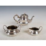 A Victorian silver three piece tea set, sugar bowl and milk jug London 1846, makers mark of RG for