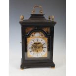 An ebonised bracket clock, Cheiter, London, the brass dial with silvered chapter ring bearing Arabic