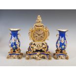 A 19th century French porcelain Rococo style clock garniture, Ed Honore, A, Paris, the mantel