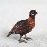 An early 20th century miniature cold painted bronze figure of a Red Grouse, 4.7cm high.