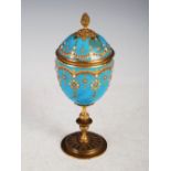 A 19th century gilt metal mounted turquoise blue ground pottery cup and cover, with gilded and