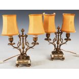 A pair of late 19th century Louis XV style ormolu and white alabaster two light candelabra, later