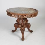 A Chinese dark wood and mother of pearl inlaid circular table, Qing Dynasty, the circular top with a