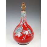 A Chinese porcelain sang de boeuf glazed bottle vase, converted to a table lamp, late Qing