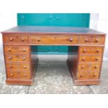 A 19th century mahogany pedestal desk, the rounded rectangular top with a black leather