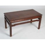 A Chinese dark wood Kang table, late Qing Dynasty, the rectangular panel top raised on four square