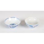 Two Chinese porcelain blue and white footed bowls of small size, one decorated with two dragons