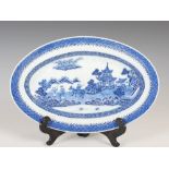 A Chinese blue and white porcelain oval shaped dish, Qing Dynasty, decorated with figures, ox and