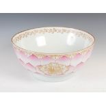 A Chinese porcelain famille rose 'lotus petal' punch bowl, Qing Dynasty, the interior with gilded