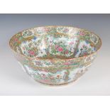 A large Chinese porcelain famille rose Canton punch bowl, Qing Dynasty, decorated with panels of