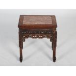 A Chinese dark wood jardiniere stand, late Qing Dynasty, the rectangular top with a mottled red
