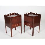 A pair of George III style mahogany tray top bedside cabinets, fitted with tambour slides and single