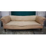 A Victorian mahogany sofa, the upholstered back, arms and seat raised on tapered cylindrical