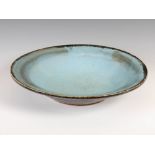 A large Chinese turquoise glazed shallow bowl, with crackle and spotted glaze, 44cm diameter x