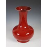 A Chinese porcelain sang-de-boeuf glazed vase, Qing Dynasty, 34.5cm high.