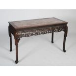 A Chinese rectangular dark wood table, Qing Dynasty, the rectangular shaped top with a mottled red