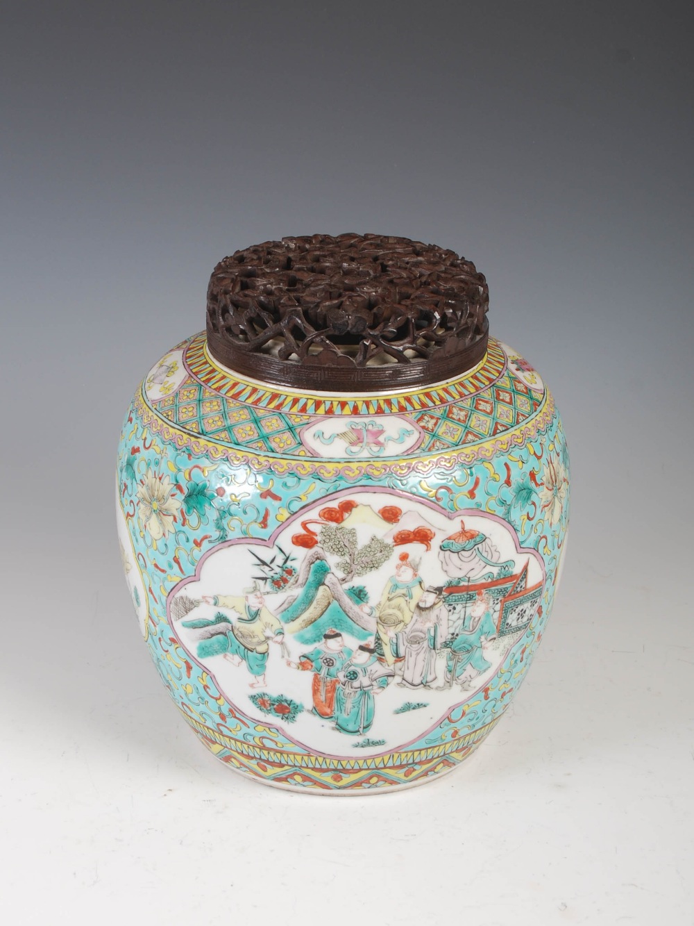 A Chinese porcelain famille verte green ground jar and pierced wood cover, Qing Dynasty, decorated - Image 3 of 10