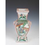 A Chinese porcelain famille verte twin handled vase, late 19th/ early 20th century, decorated with