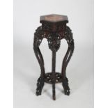 A Chinese dark wood hexagonal shaped jardiniere stand, Qing Dynasty, the hexagonal shaped top with a