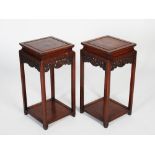 A pair of Chinese dark wood square shaped urn stands, late 19th/early 20th century, the square panel