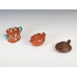 Three assorted Chinese Yixing stoneware teapots and covers, Qing Dynasty and later, one of rounded