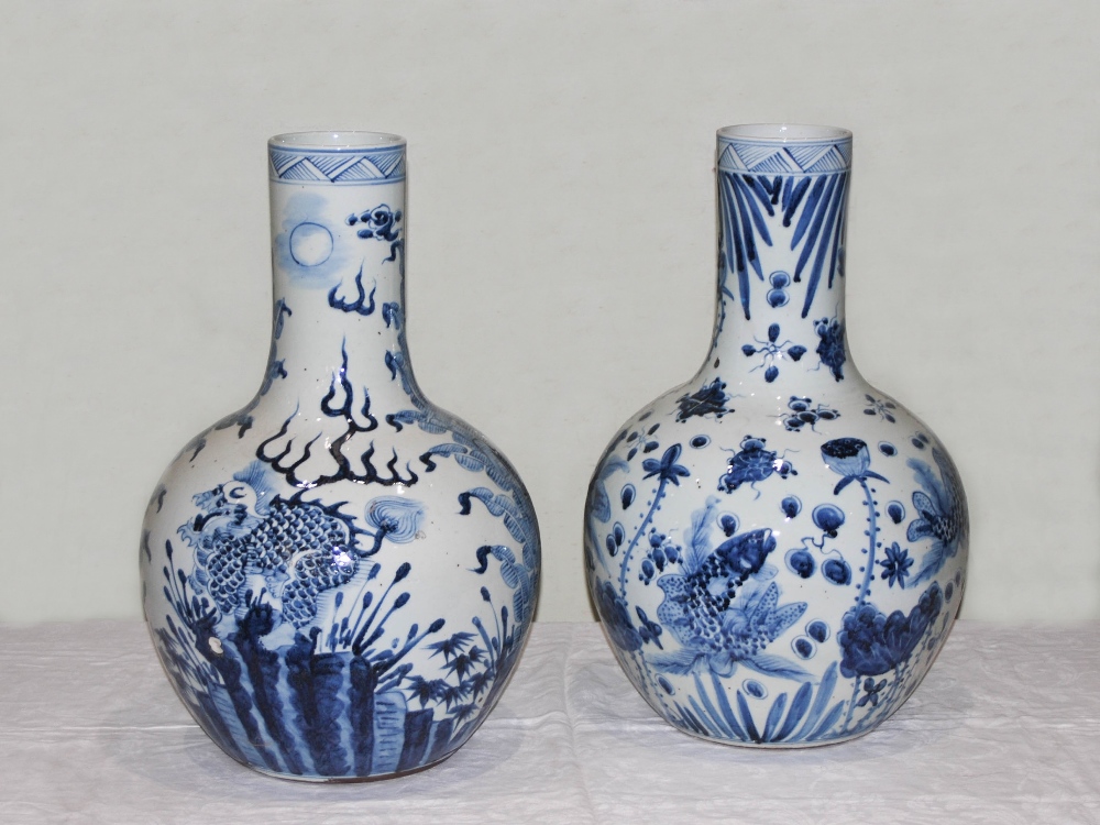 A pair of decorative Chinese blue and white porcelain bottle vases, decorated in the Ming style with - Image 3 of 13