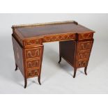 An Edwardian mahogany, satinwood and marquetry inlaid desk by Edwards & Roberts, the rectangular top