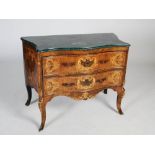 A late 19th/early 20th century Continental rosewood, walnut and marquetry inlaid serpentine commode,