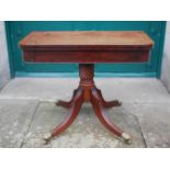 A 19th century mahogany and ebony lined pedestal card table, the rounded rectangular