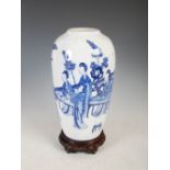 A Chinese blue and white porcelain vase, Qing Dynasty, decorated with ladies in a fenced garden of