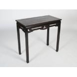 A Chinese black wood rectangular table, late Qing Dynasty, the rectangular panel top above a pierced
