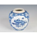 A Chinese porcelain blue and white jar, Qing Dynasty, decorated with oval shaped panels enclosing