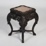 A rare Chinese dark wood urn stand, Qing Dynasty, the shaped square top with a mottled red and white