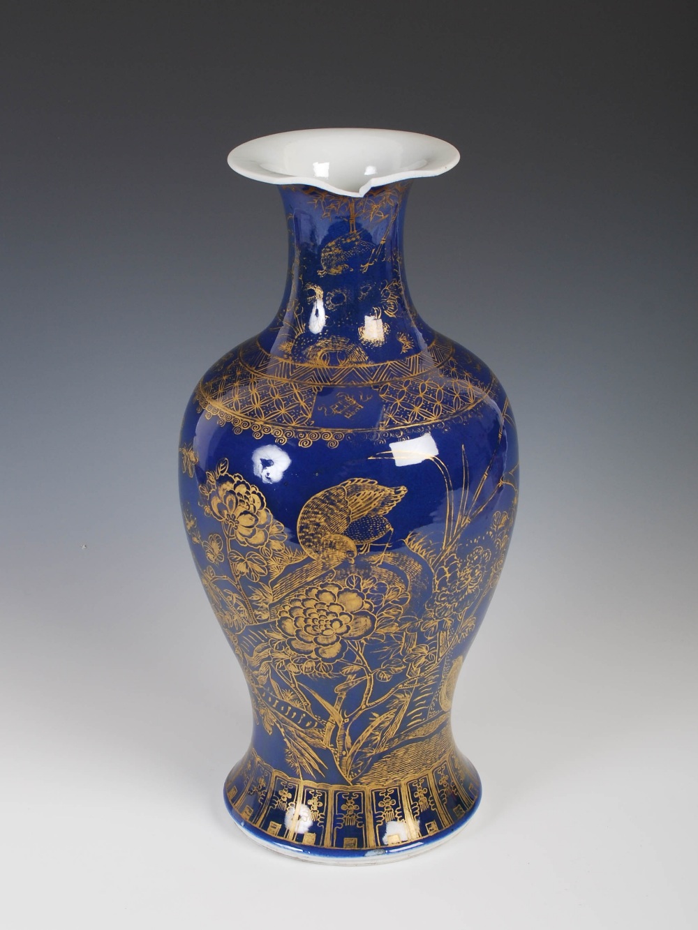 A Chinese porcelain powder blue ground vase, Qing Dynasty, with gilded decoration of peony and birds