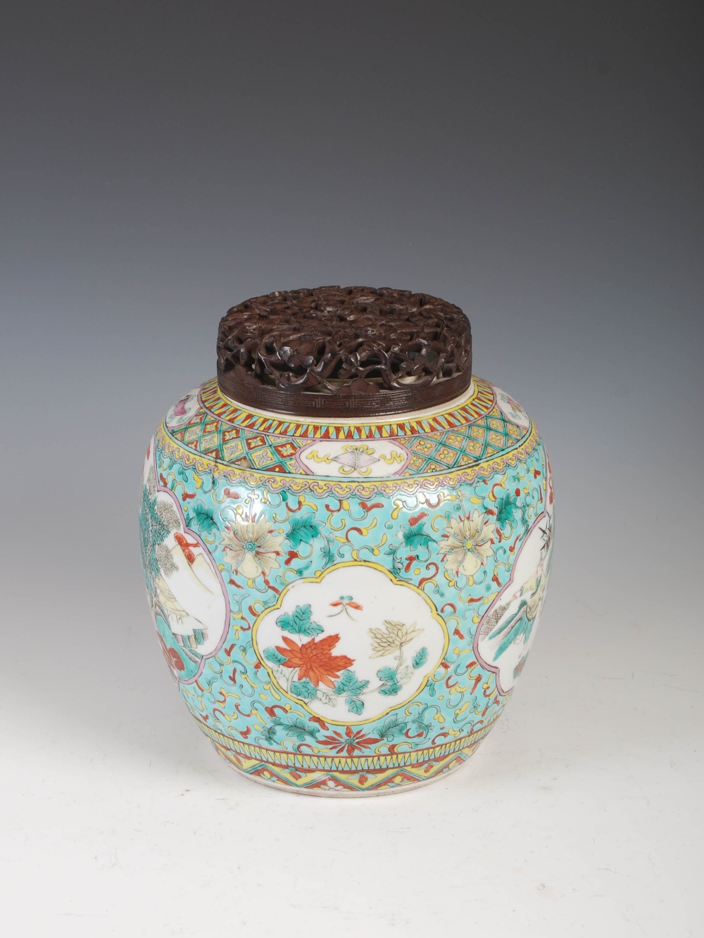 A Chinese porcelain famille verte green ground jar and pierced wood cover, Qing Dynasty, decorated - Image 2 of 10