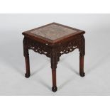 A Chinese dark wood jardiniere stand, late Qing Dynasty, the square top with a mottled red and white