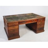 A George III mahogany partners desk by Willson, 68 Great Queen Street, London, the rectangular top