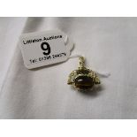 Gold stone set swivel fob