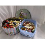 Tin and tub of costume jewellery, beads etc