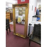 Large ornate gilt framed and bevelled glass mirror (89cm x 181cm)