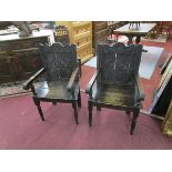 Pair of antique carved oak armchairs