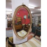Ornate oval wall mirror