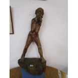 Primitive carved boy figure